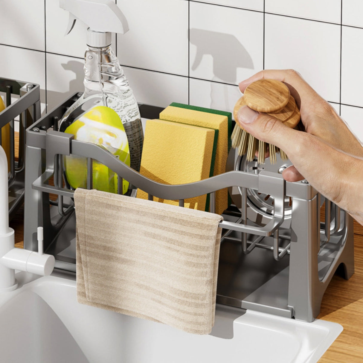 Hanging rod on the sink caddy with a dish cloth drying over it