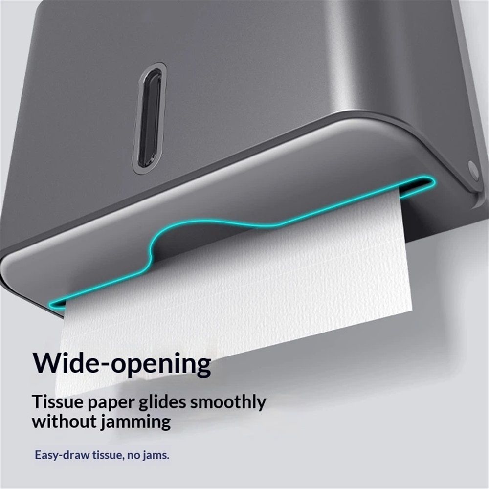Grey paper towel dispenser opened for refilling with folded hand towels