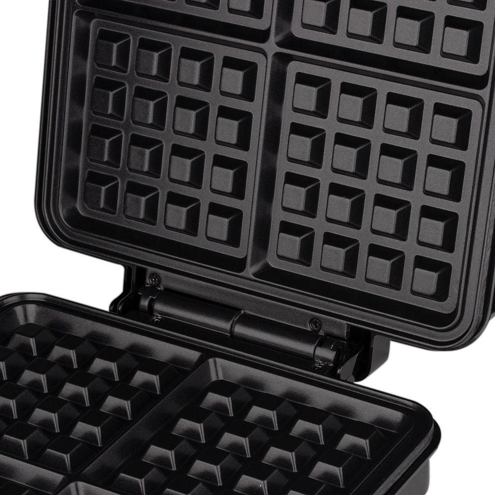 Side view of waffle maker showing hinged lid and compact body