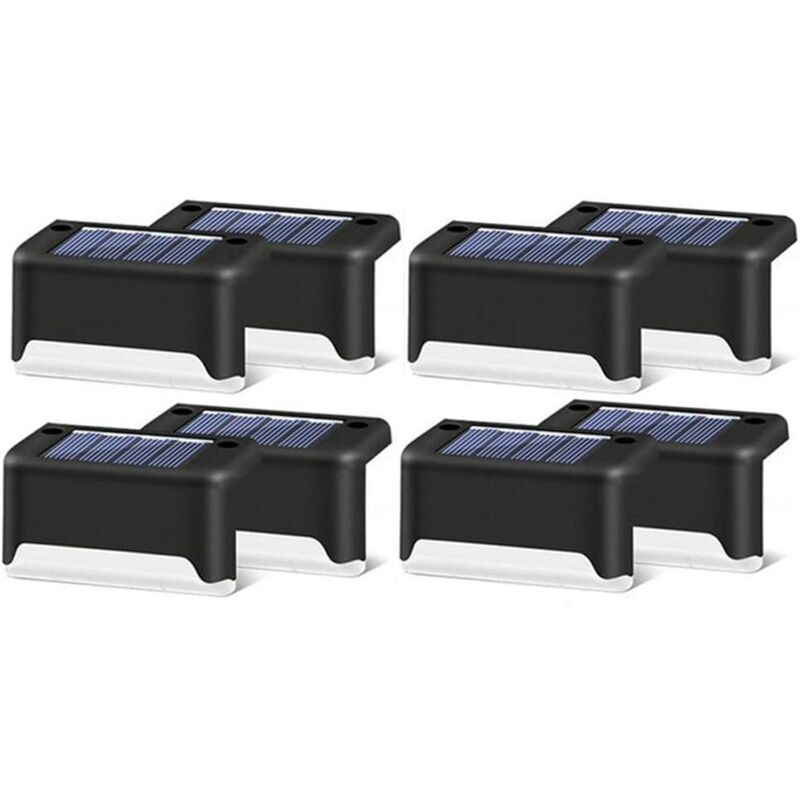 Black shell warm white solar step lights along outdoor decking steps