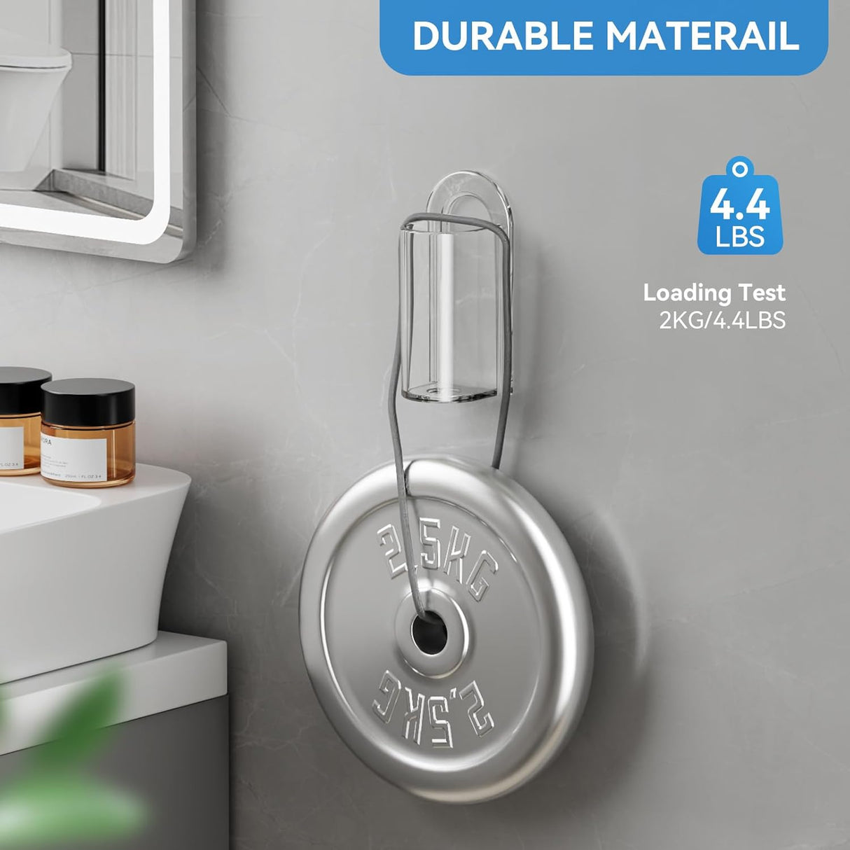 Two transparent toothbrush holders mounted side by side on a wall beside a bathroom mirror