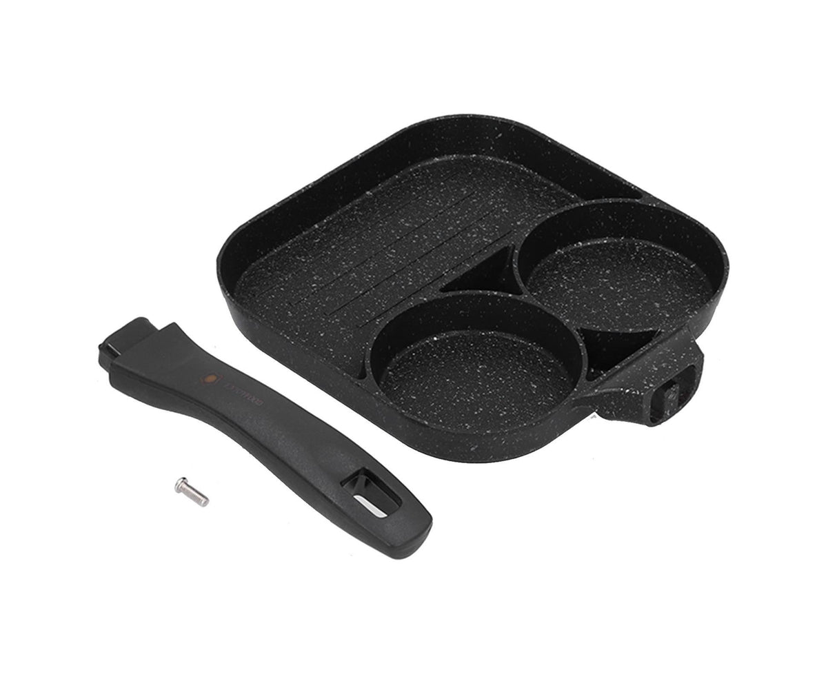 Eggs, steak and sausages cooking together in the three section aluminium pan