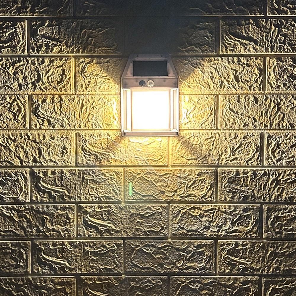 Warm white solar wall lights lighting a garden pathway and stairs