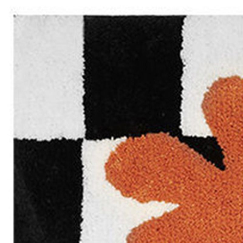 Checkered anti skid doormat used in front of a bathroom shower area