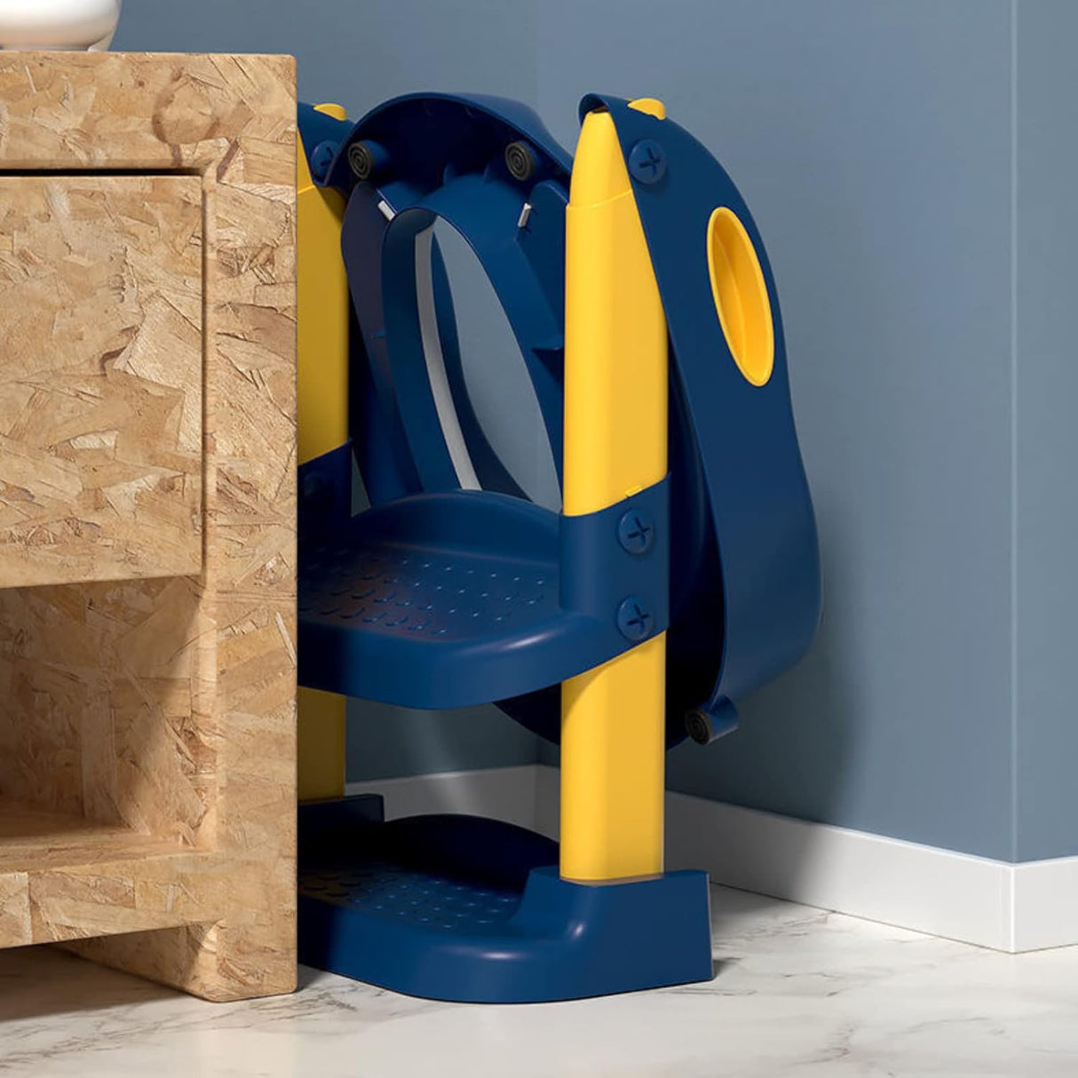 Child using potty training seat with steps