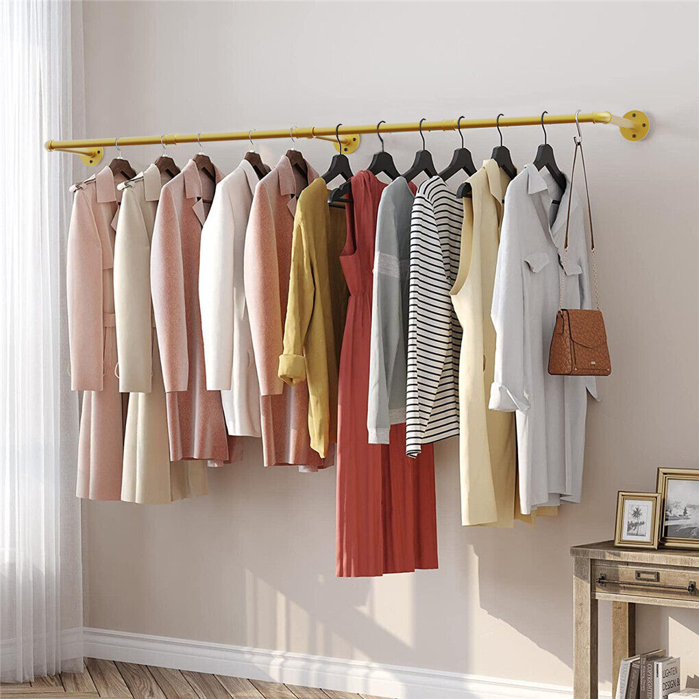 Gold wall mounted clothes rail in vintage iron