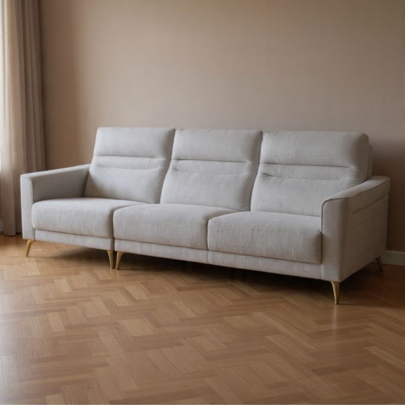 Oliva light grey fabric sofa in a modern living room
