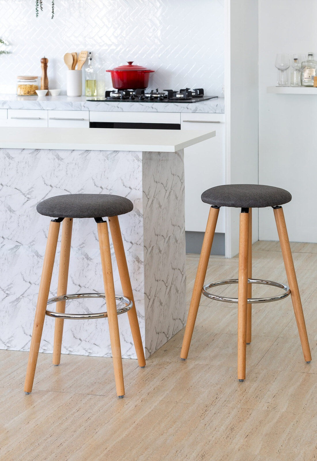 Mentone grey padded bar stool with cotton seat and steel frame in a modern kitchen