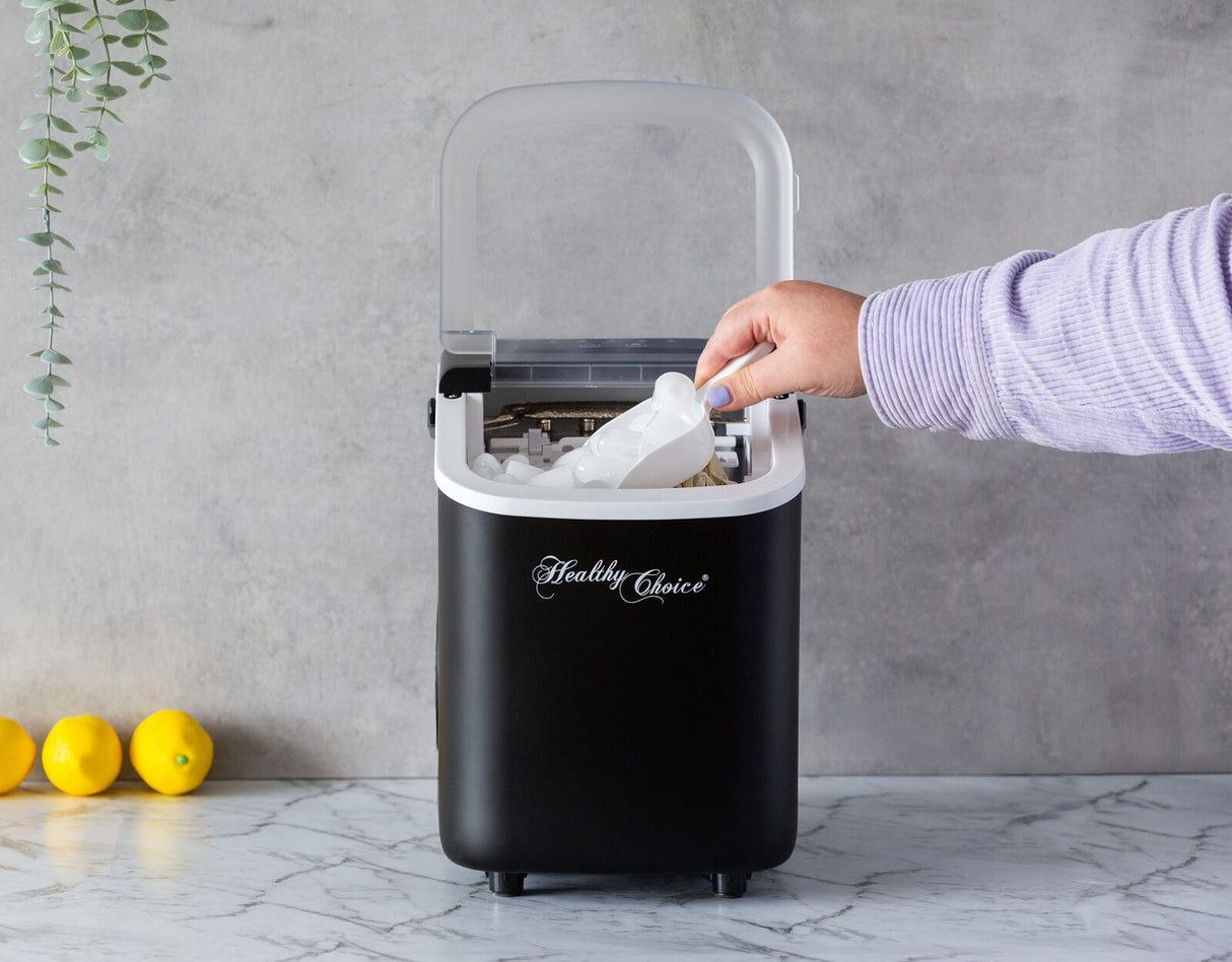 1.1 L water tank being filled in the portable ice maker