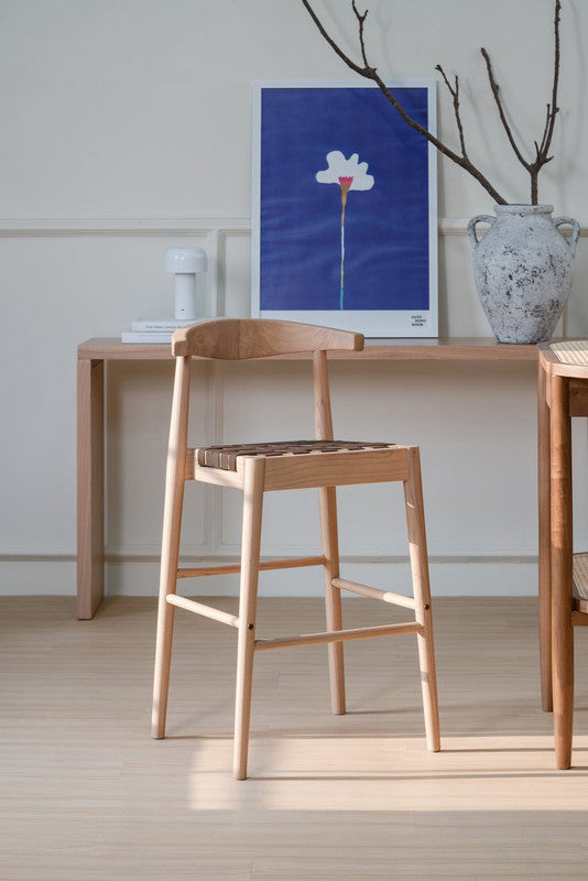 Aspendale natural oak counter stool with woven leather seat at a kitchen island