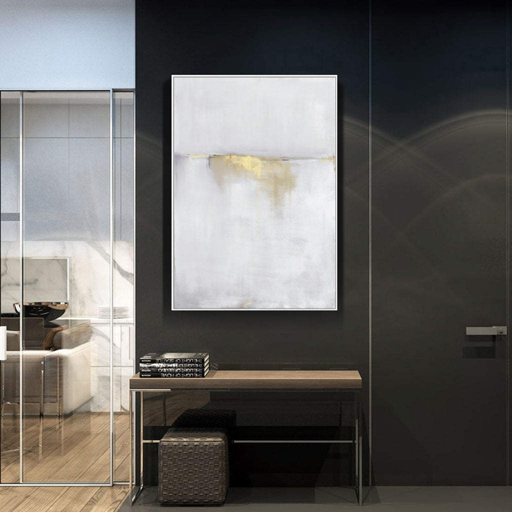 Close view of the gold and white abstract canvas showing soft colour blocks and gilded accents