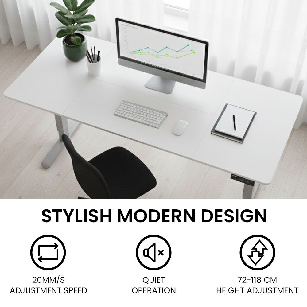 Turner white electric standing desk with silver frame in a home office