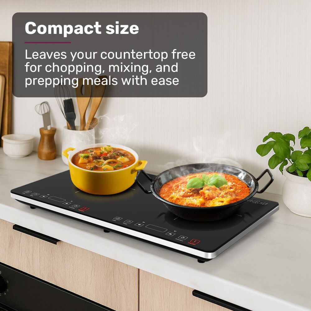 Portable induction cooktop on a benchtop with a saucepan on one zone