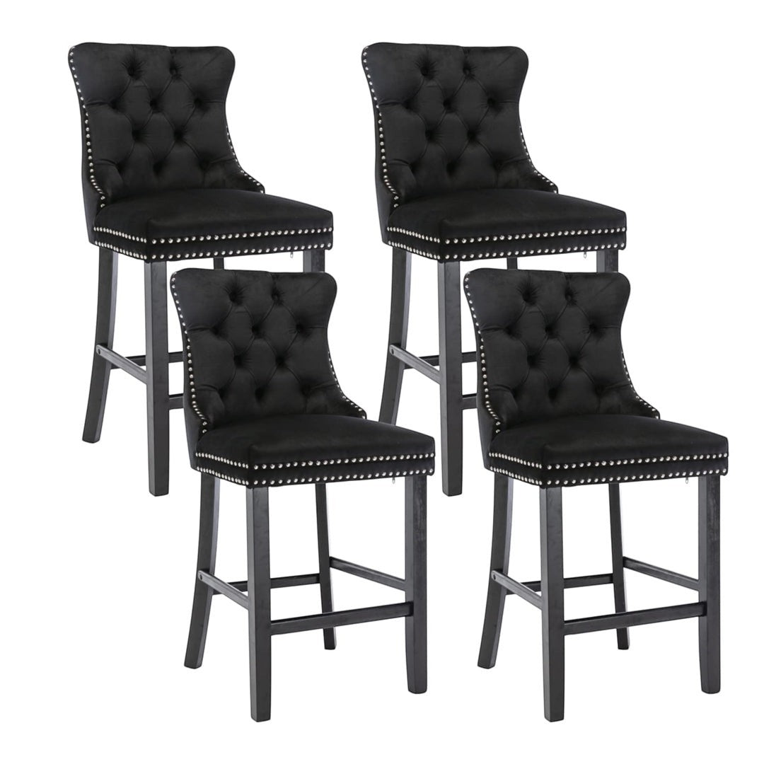 Ranelagh black velvet bar stool with silver stud trim and wooden legs in a dining room