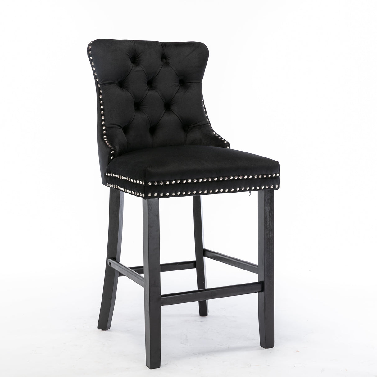 Ranelagh black velvet bar stool with silver stud trim and wooden legs in a dining room