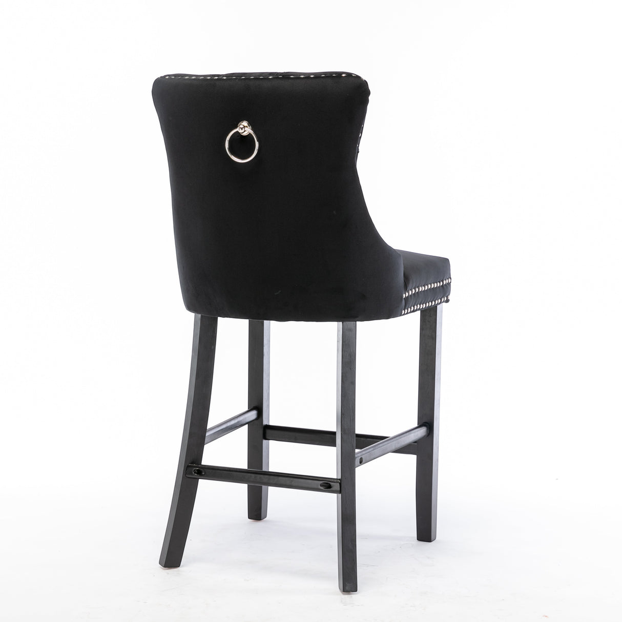 Ranelagh black velvet bar stool with silver stud trim and wooden legs in a dining room
