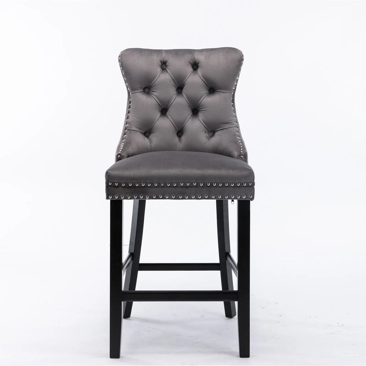 Waterways grey velvet bar stool with silver stud trim and wooden legs in a dining room