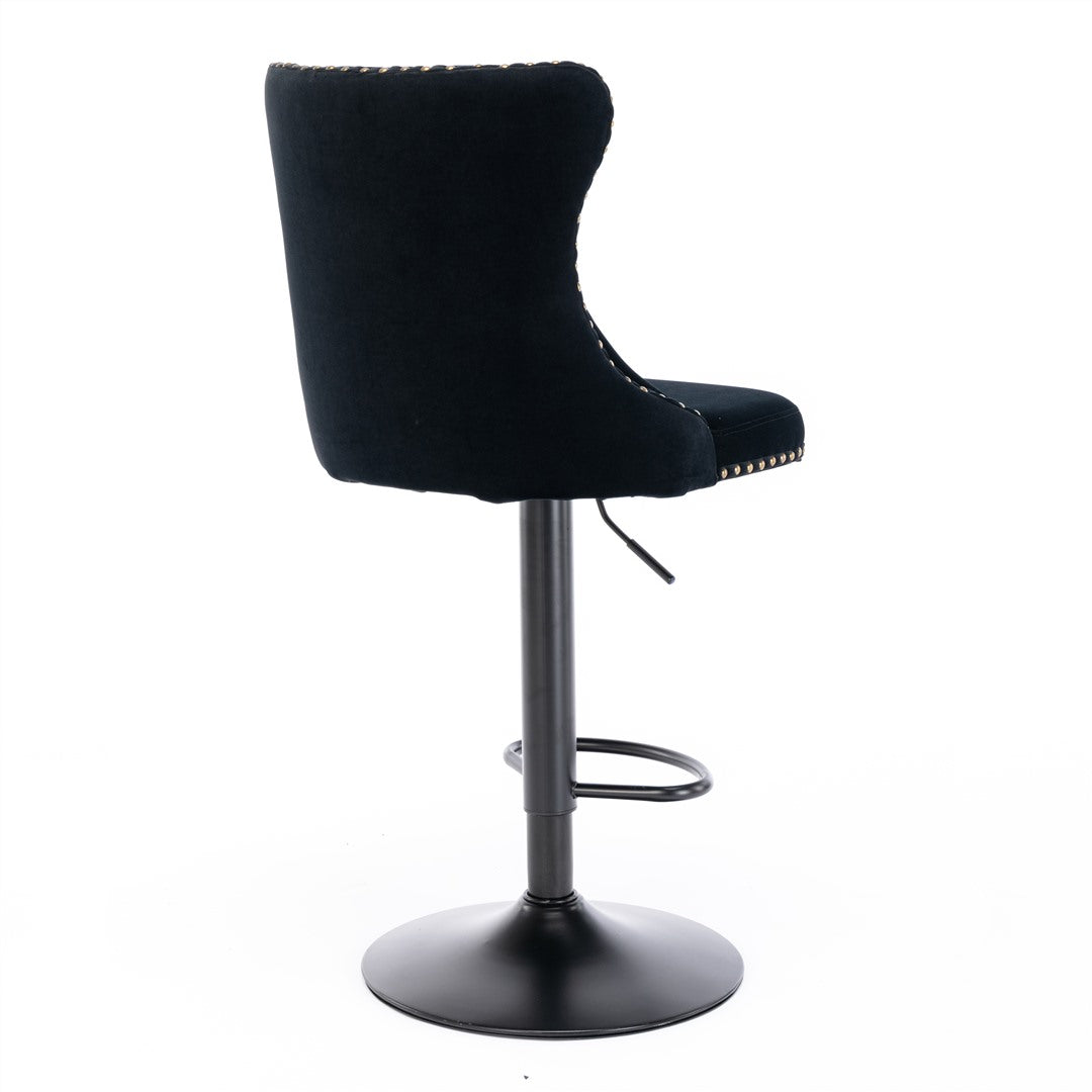 Kilcunda black velvet tufted swivel bar stool with nailhead trim in a modern kitchen