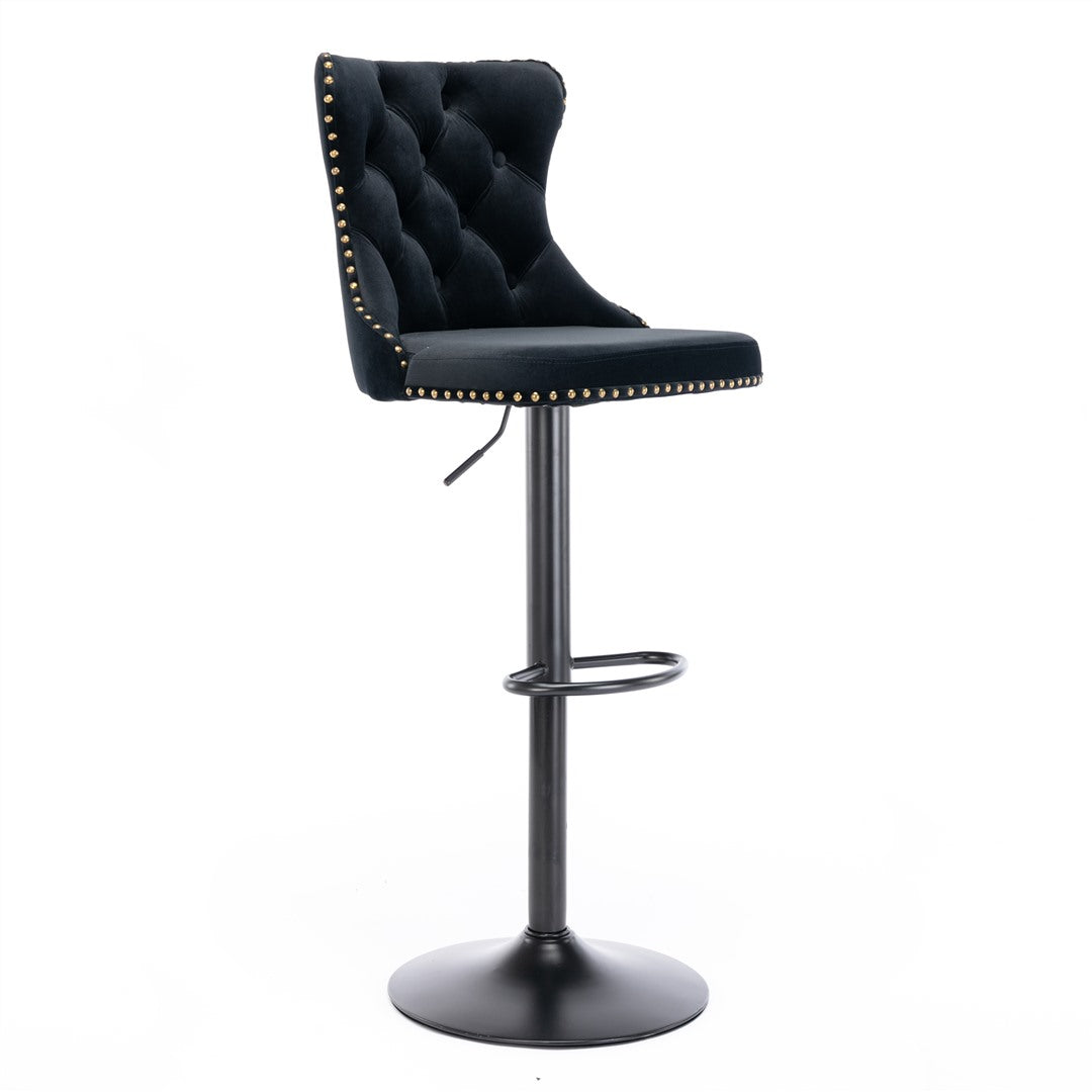 Kilcunda black velvet tufted swivel bar stool with nailhead trim in a modern kitchen