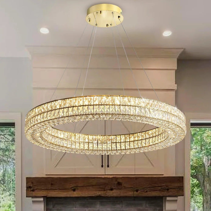 Gold crystal ring chandelier illuminated in a room