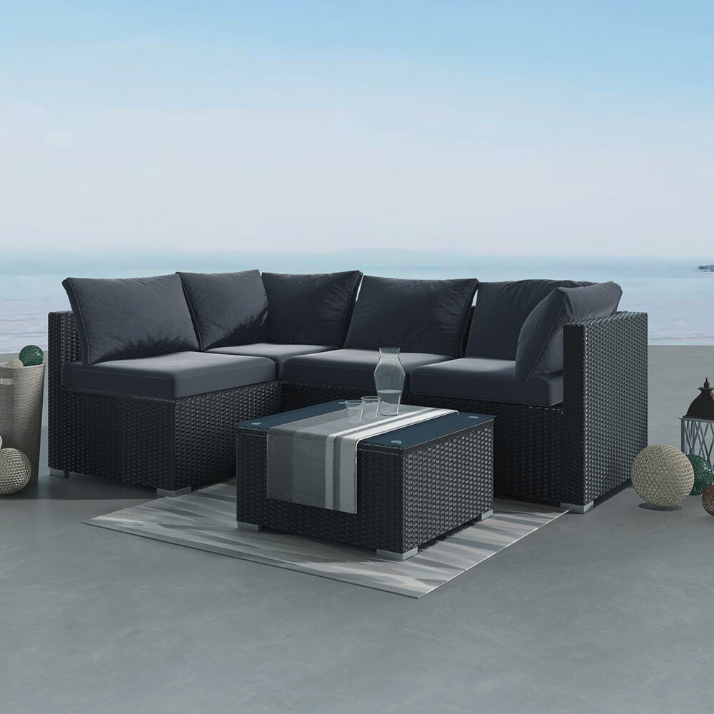 Caloundra black wicker outdoor lounge set on a sunny patio