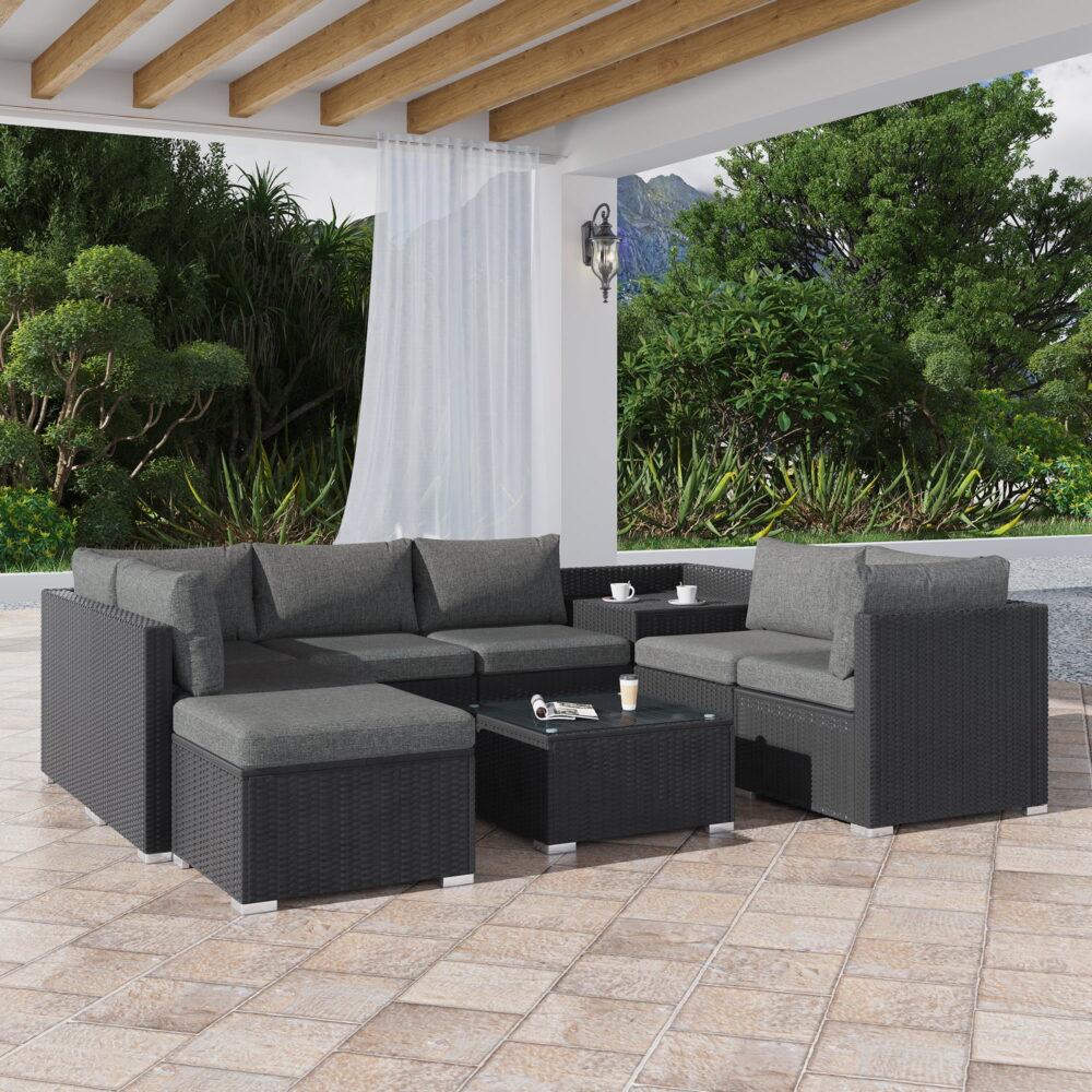 Marcoola black wicker outdoor lounge set on a sunny patio