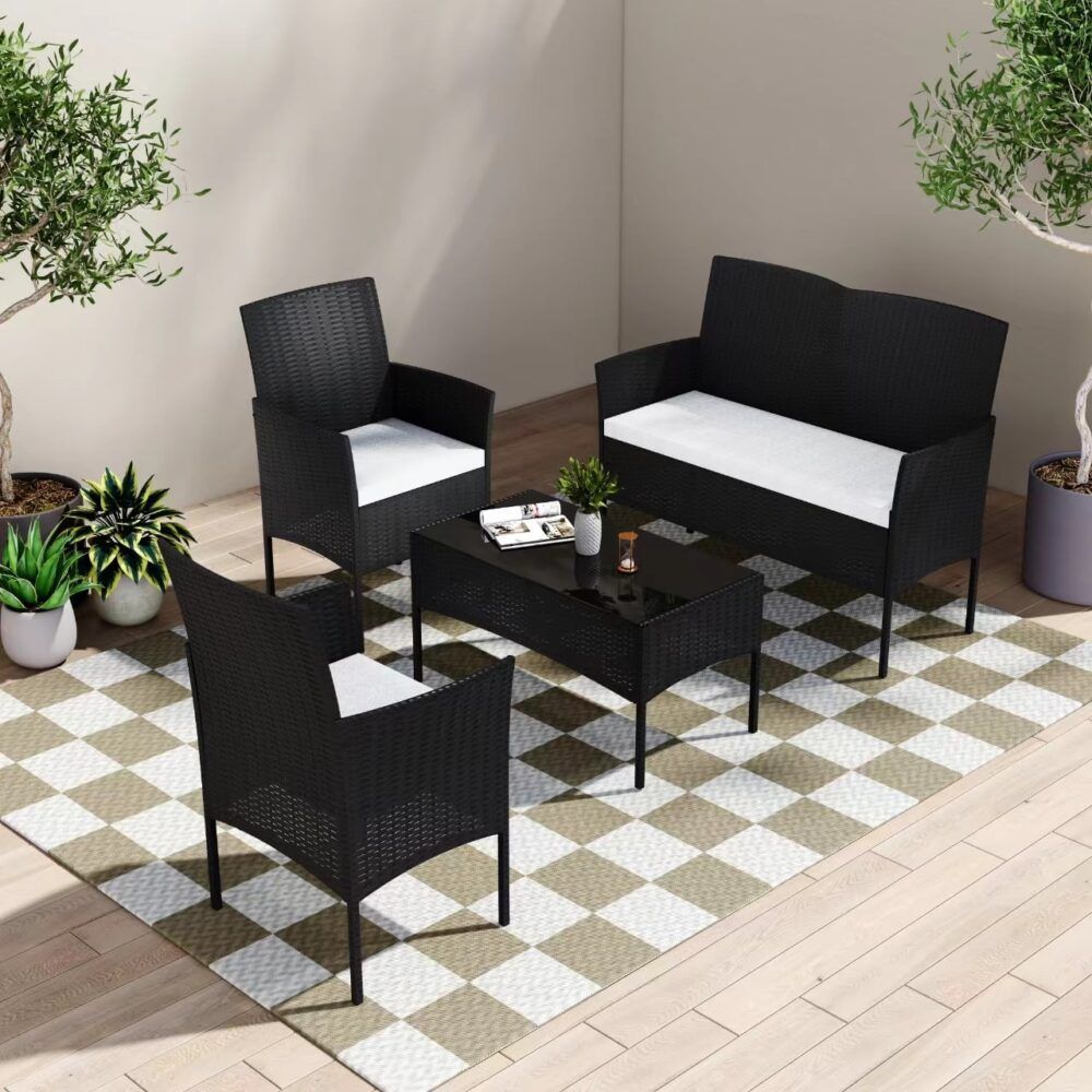 Shelly Beach black wicker outdoor lounge set on a sunny patio