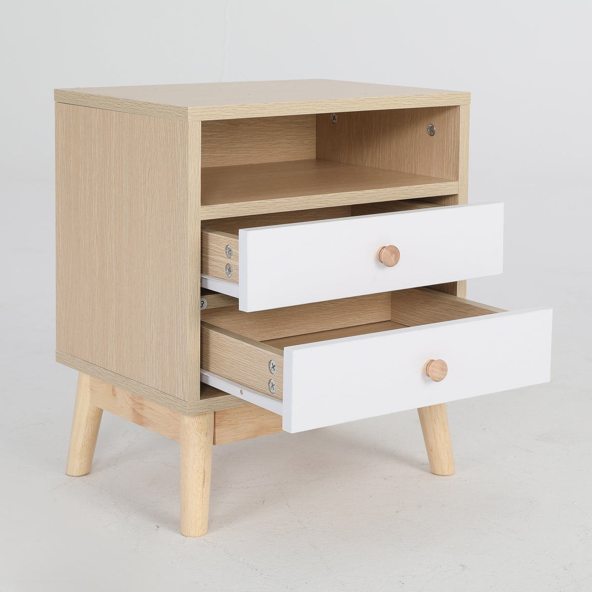 Suffolk Park oak two drawer bedside tables shown as a matching pair in a warm bedroom