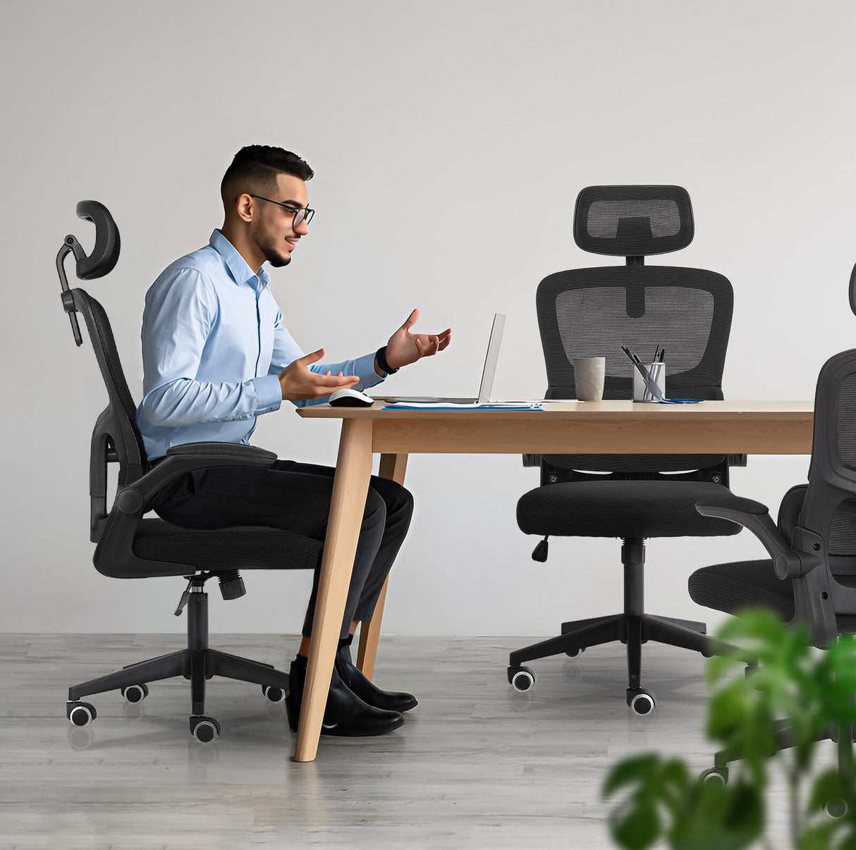 Bridgetown black mesh office chair with flip up armrests in a home office