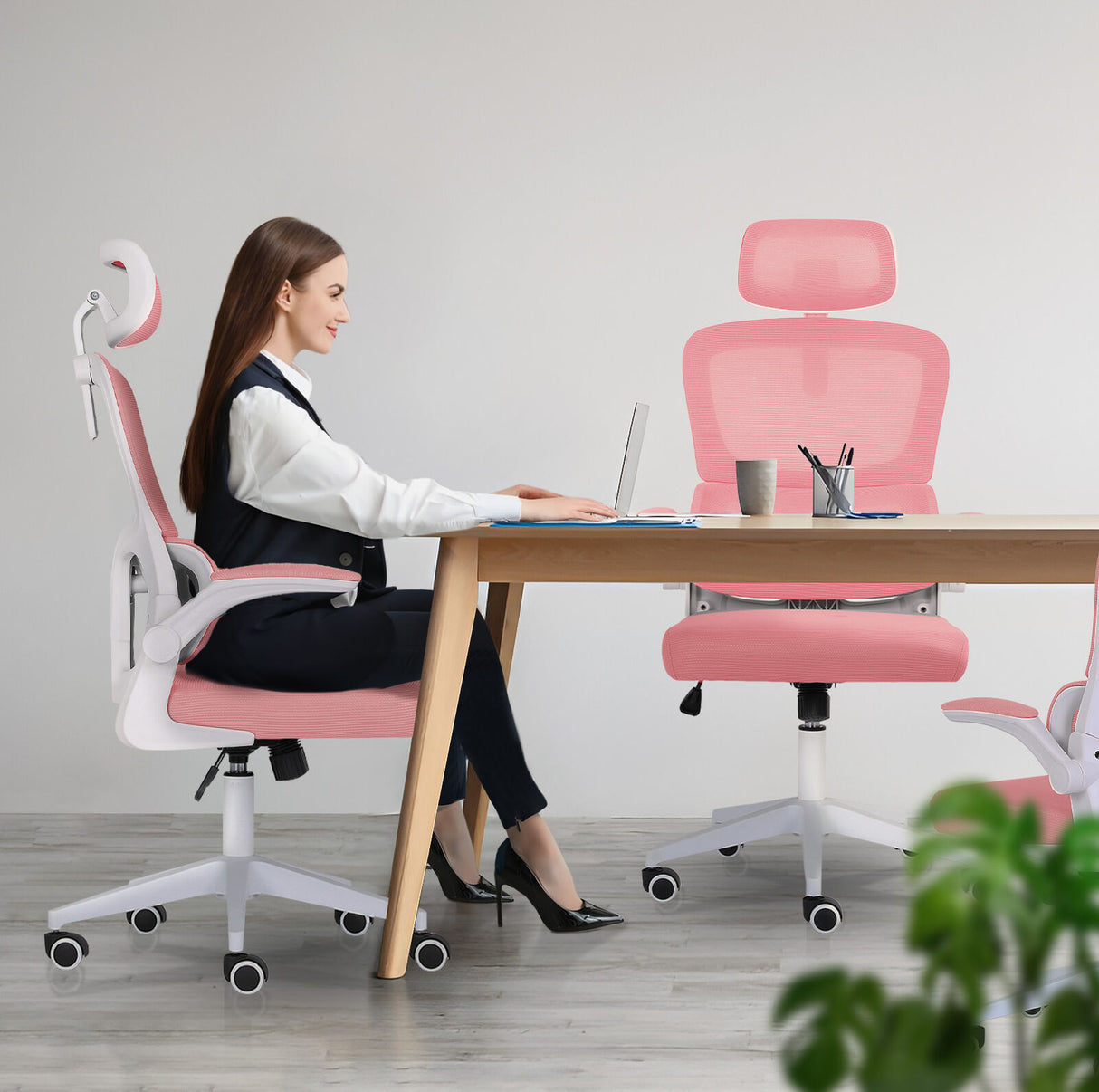 Bridgetown pink mesh office chair with flip up armrests in a home office