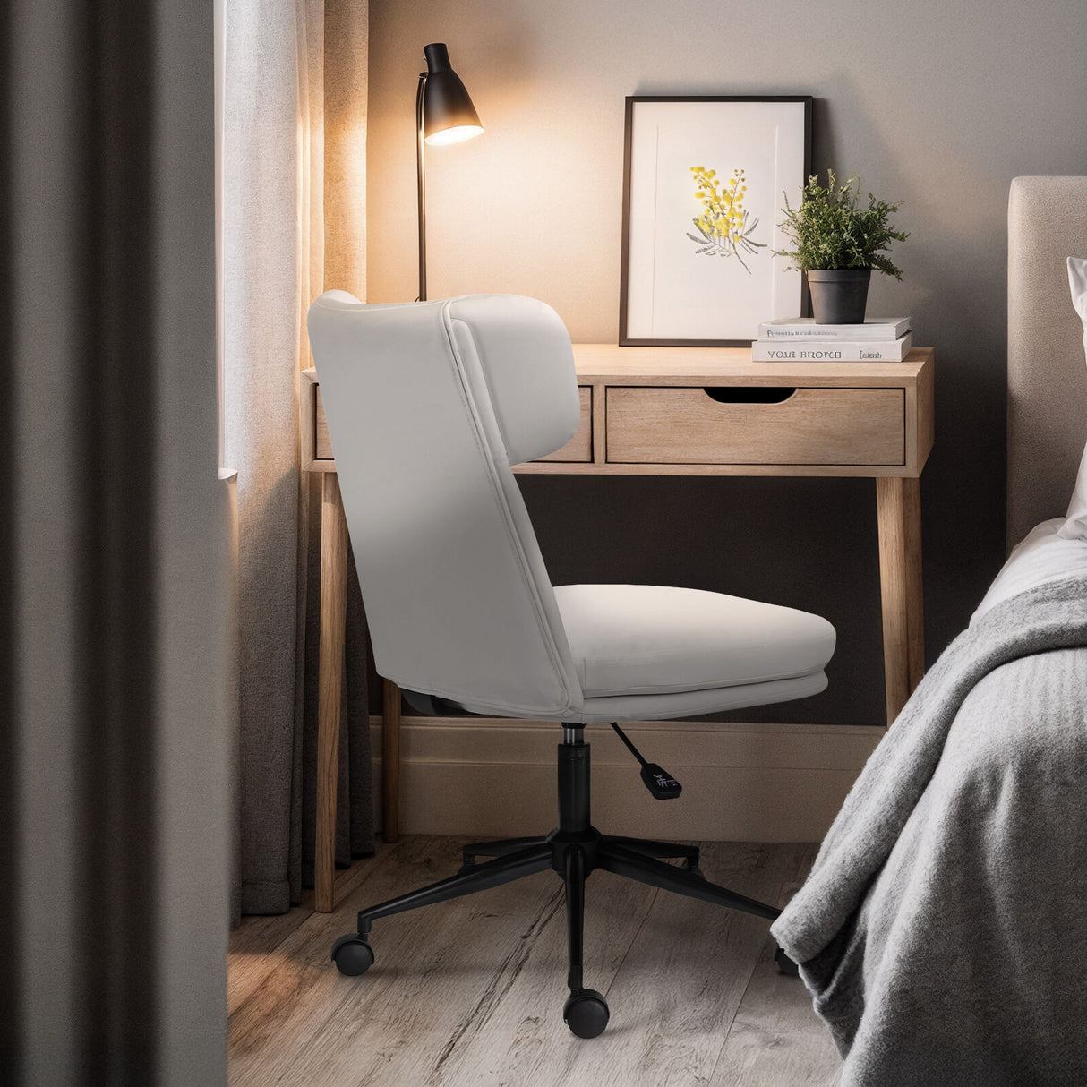 Iluka white faux leather office chair at a desk, view 4