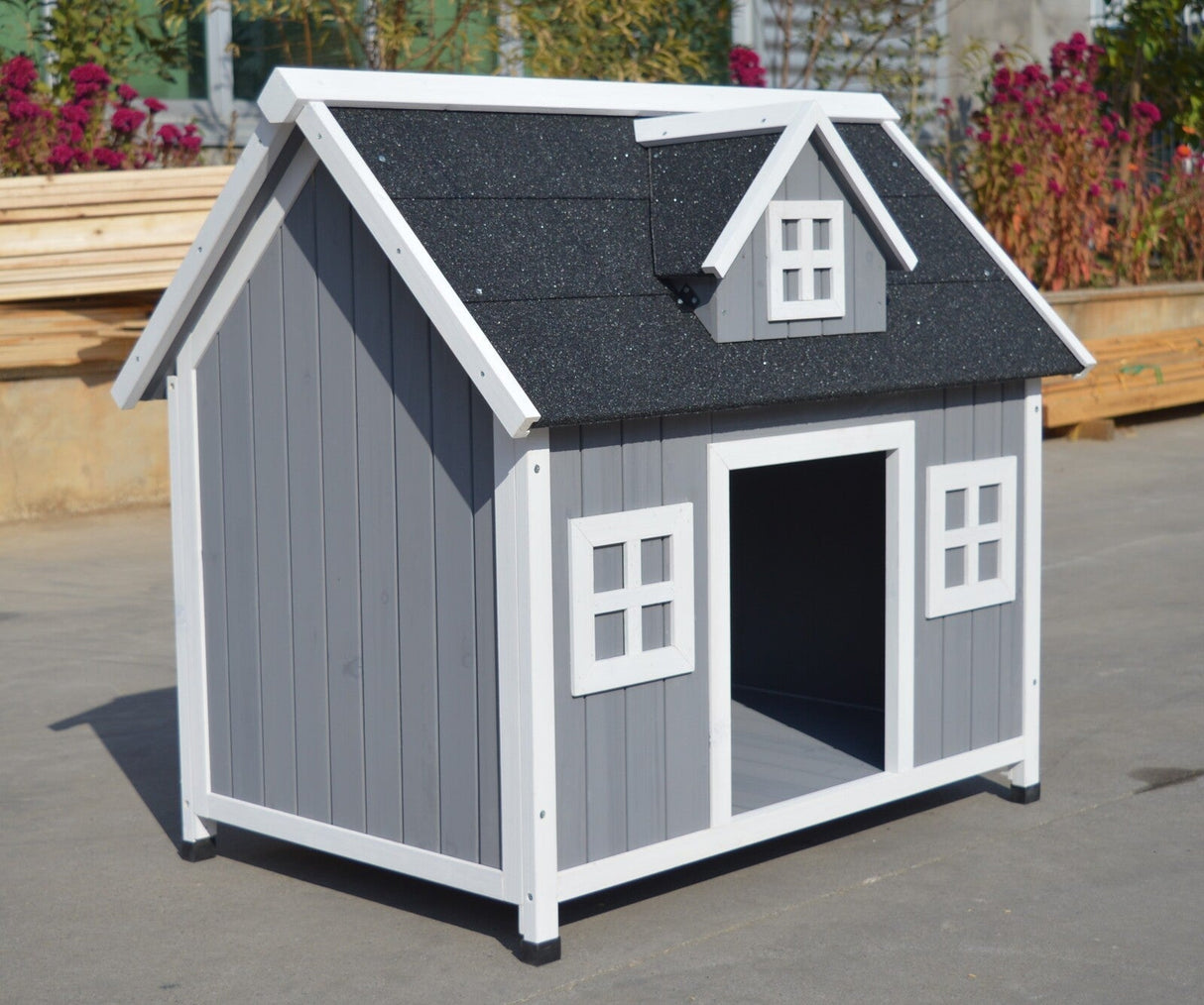 Gracetown grey timber dog kennel with an asphalt roof for dogs up to 30kg in a garden