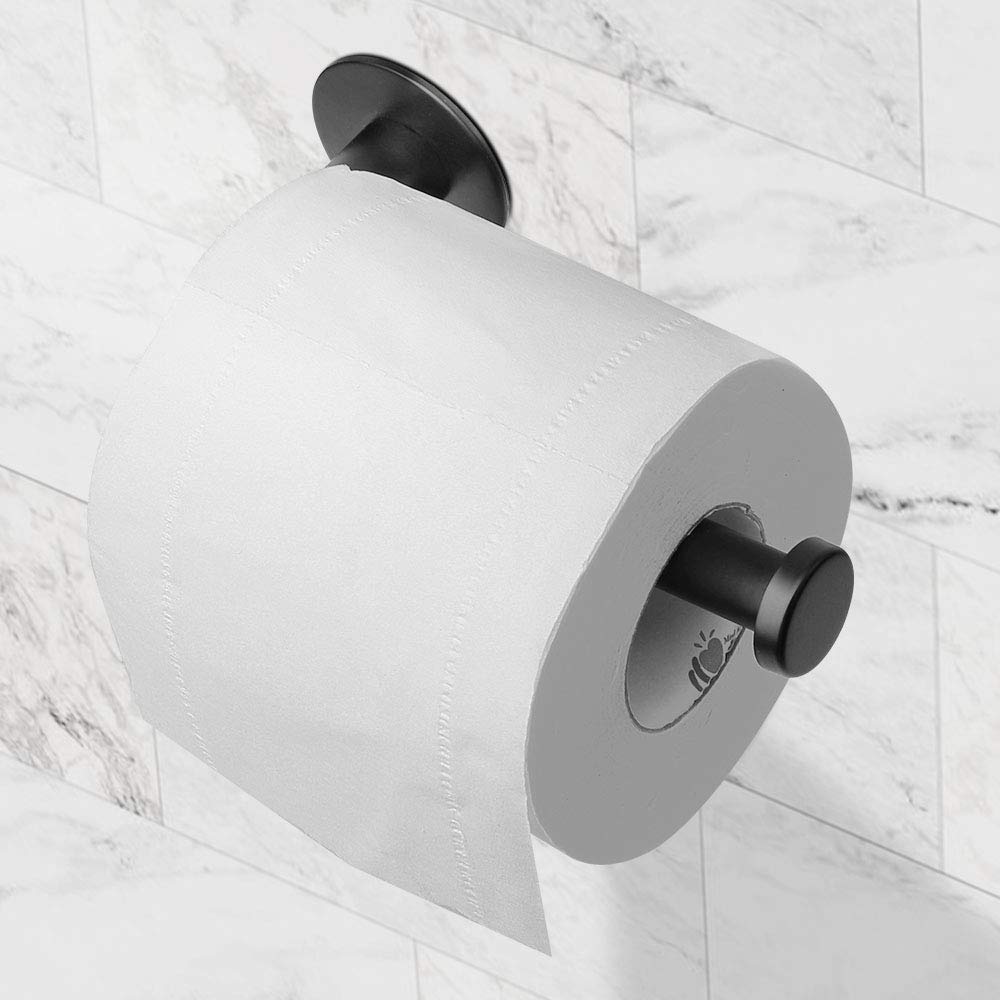 Toilet roll loaded onto the matte black adhesive paper holder