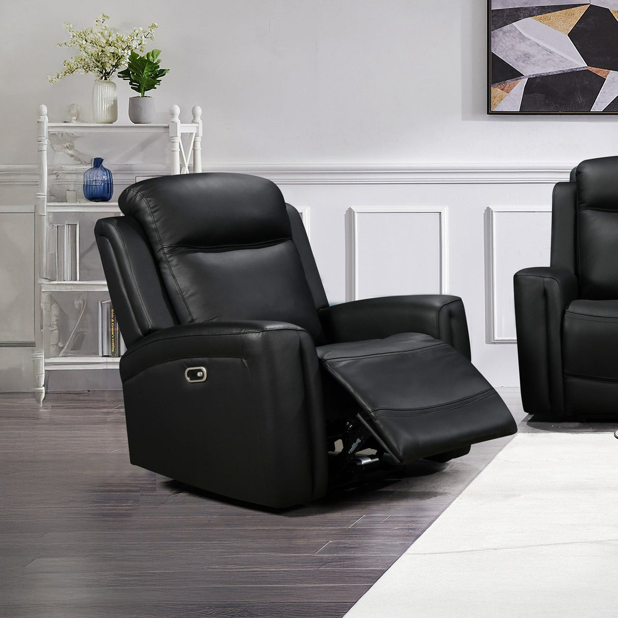 Mijas black faux leather recliner sofa in a modern living room