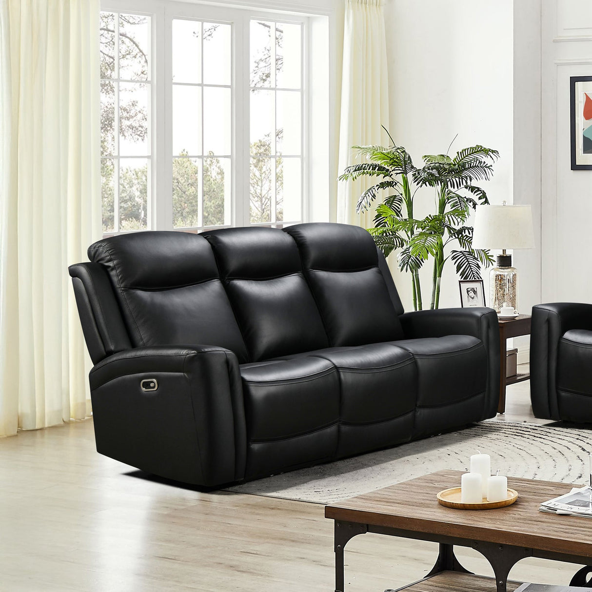 Mijas black faux leather recliner sofa in a modern living room