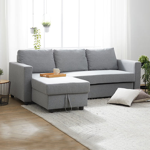 Santanyi grey fabric sofa bed in a modern living room