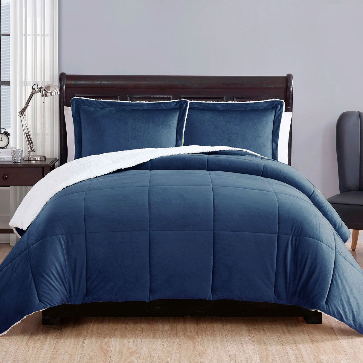 Foss Cross navy blue micro mink comforter with plush sherpa reverse on a Queen bed with pillowcases
