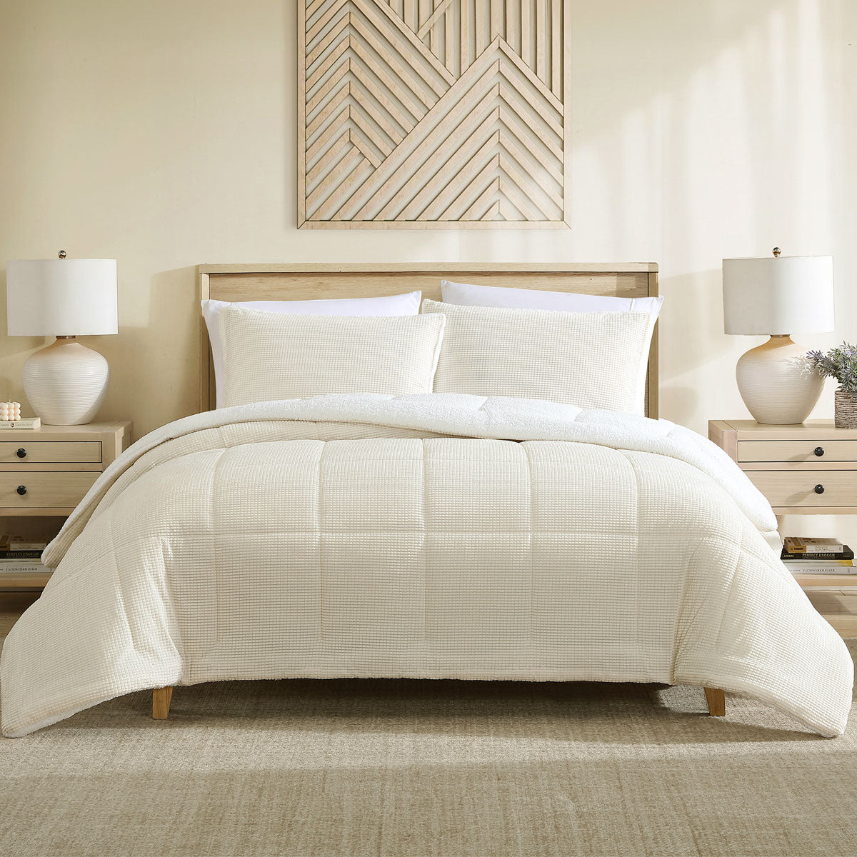 Cream velvet comforter set with a sherpa reverse and two pillowcases on a made bed