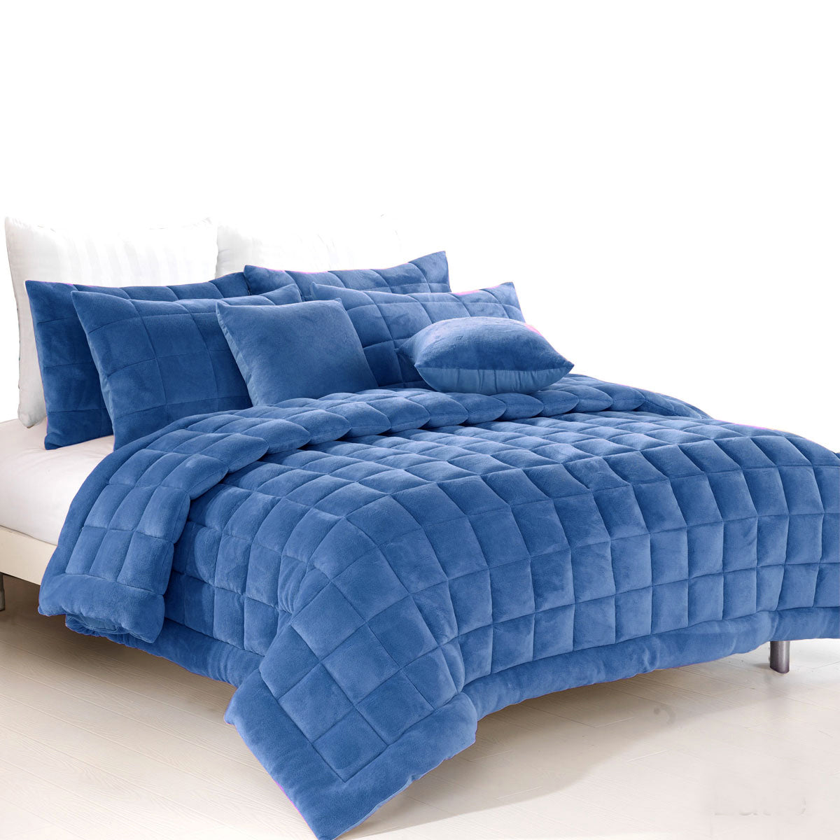 Sherborne denim faux mink quilted comforter set on a King bed with two pillowcases