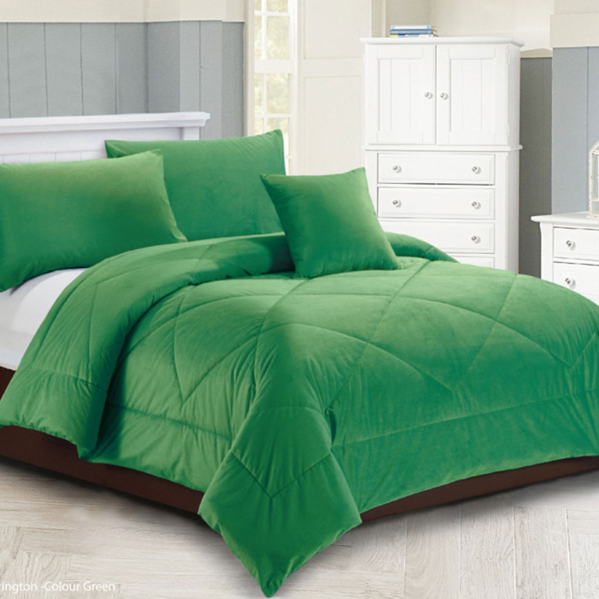 Green diamond quilted quilt with two pillowcases on a Queen bed