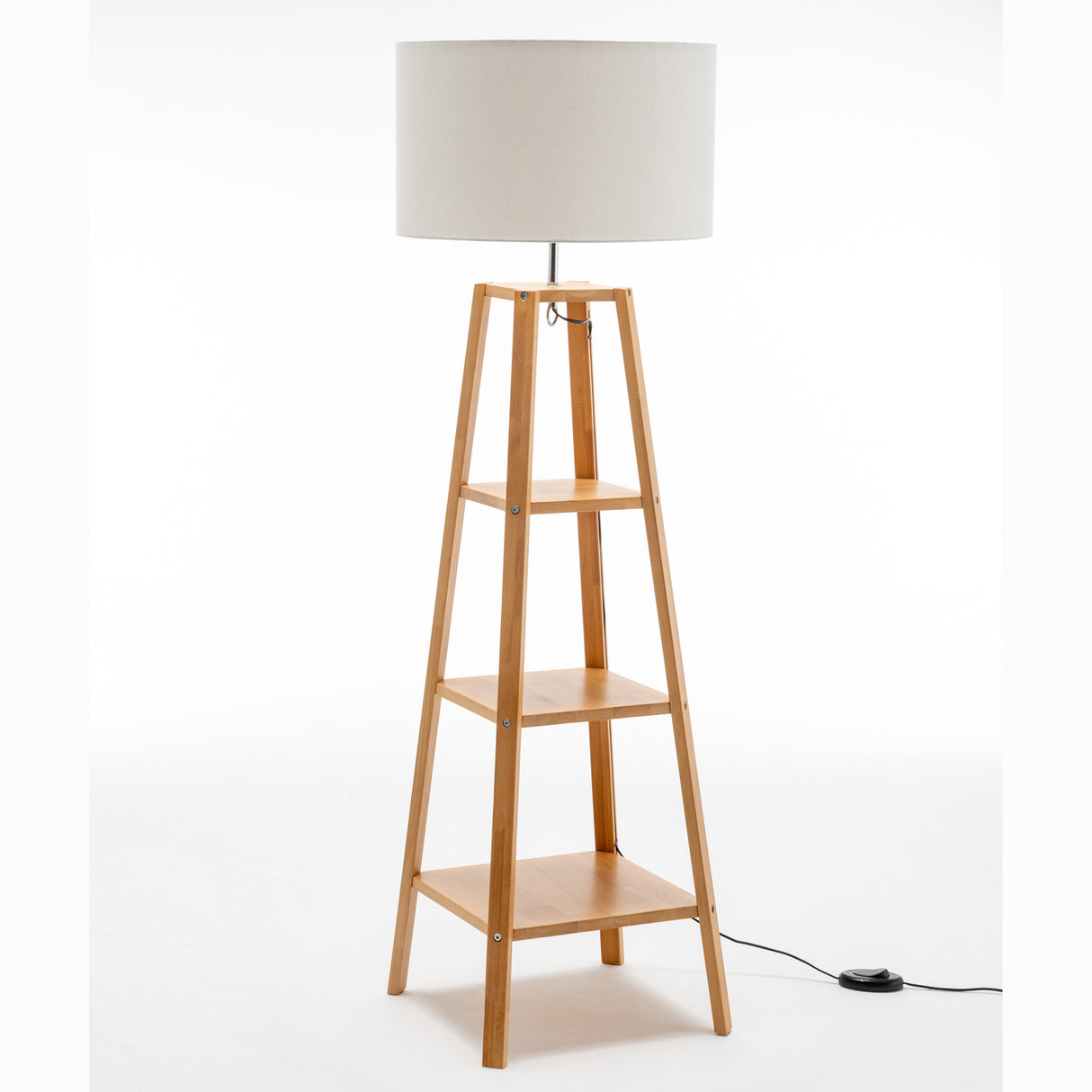 Three tier wooden floor lamp with storage shelves and white linen drum shade