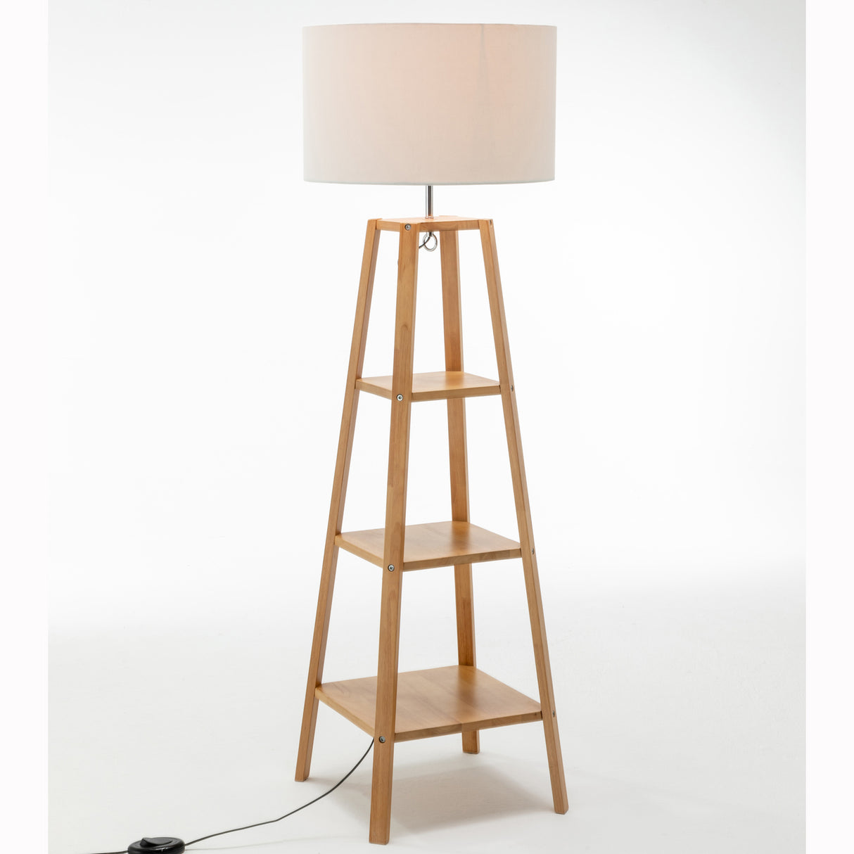 Three tier wooden floor lamp with storage shelves and white linen drum shade