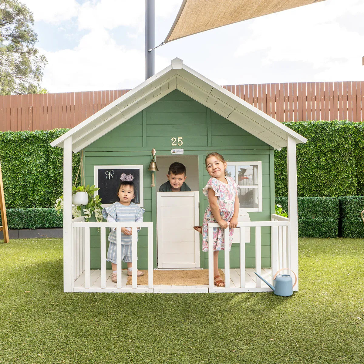 Wooden Cubby House with Veranda and Flower Bed