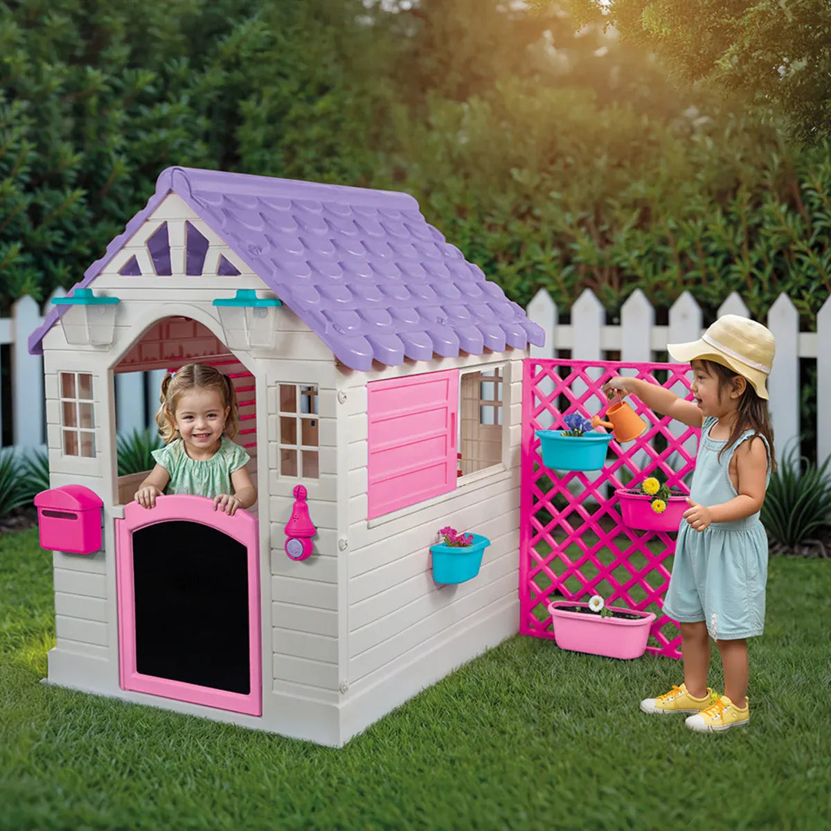 Garden playhouse with pink fence