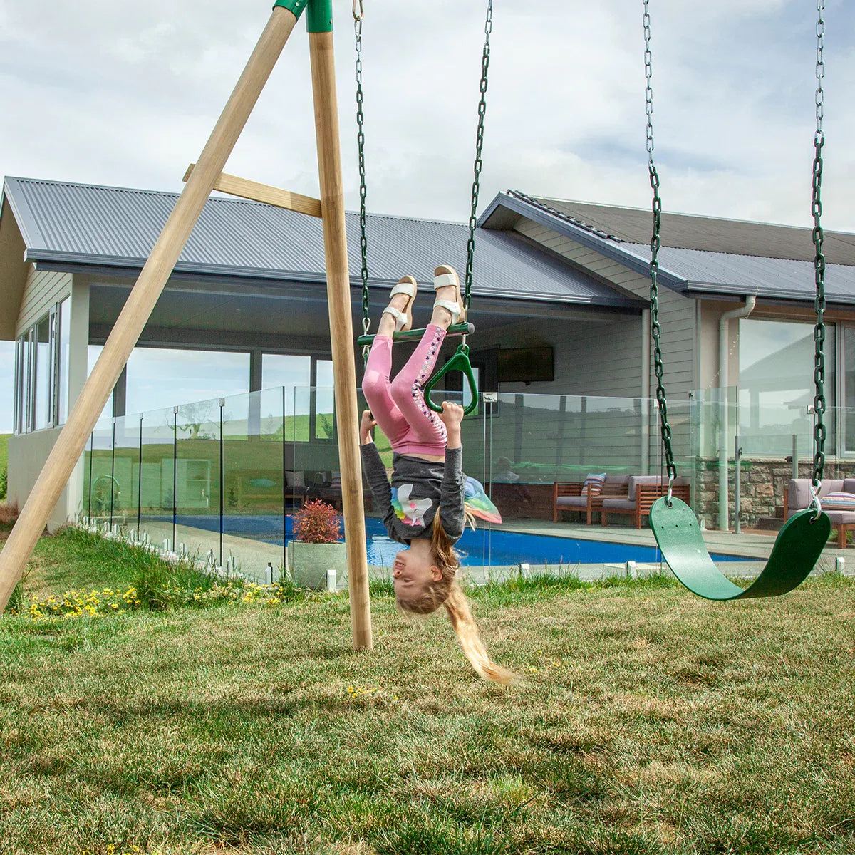 Timber swing set with two swings and trapeze view 2