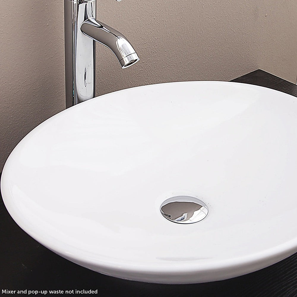 White oval ceramic above counter basin, angled view
