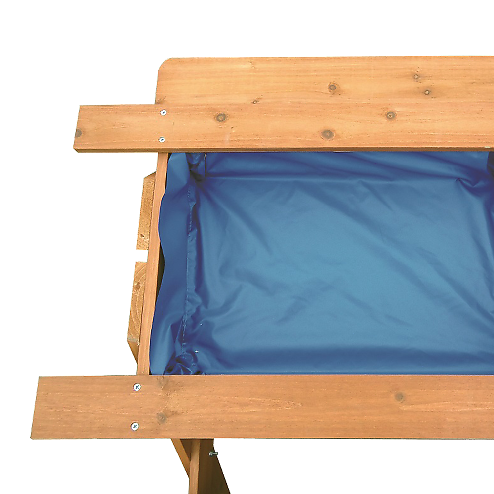 Kids using the sand and water picnic table