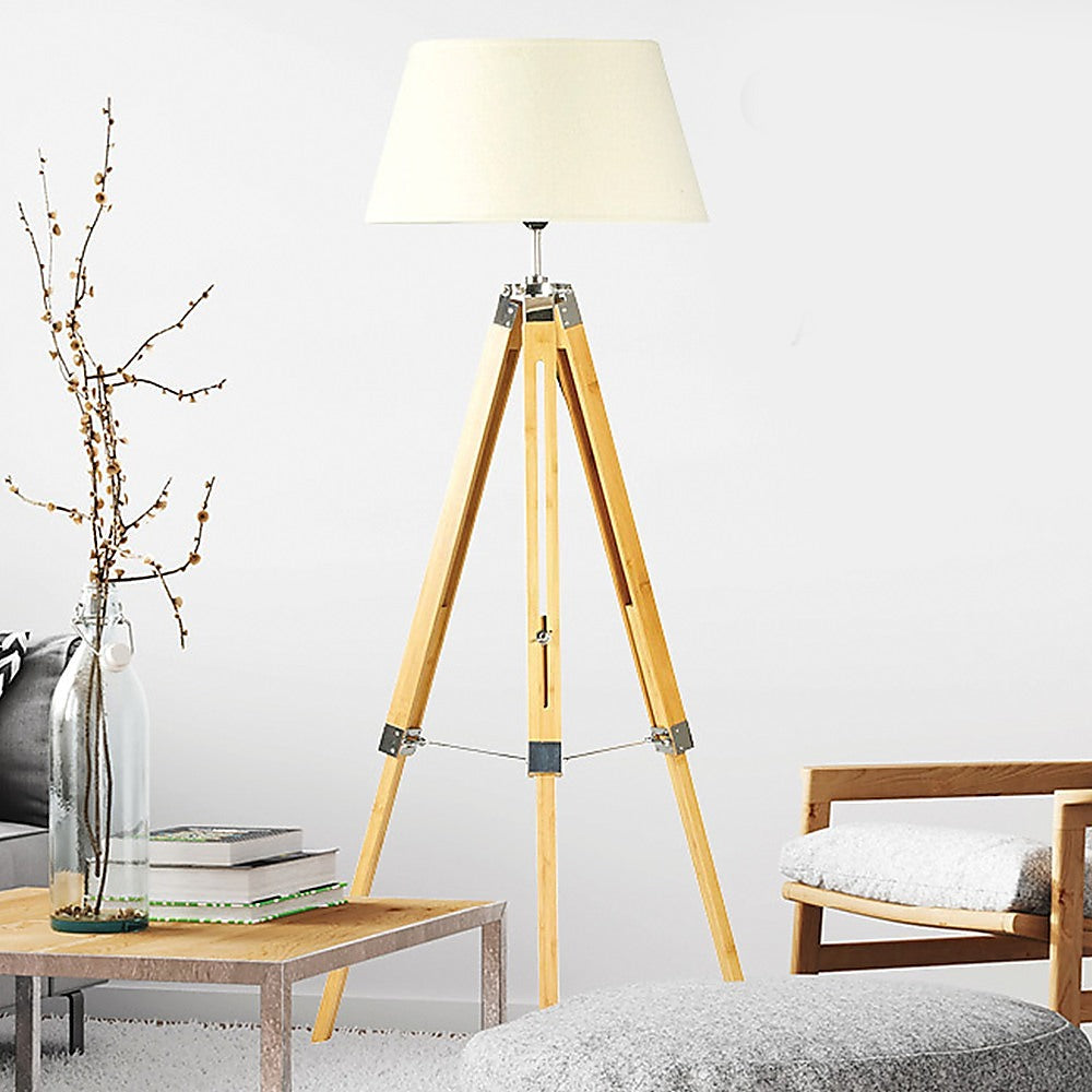 Wood tripod floor lamp with white fabric shade and chrome accents