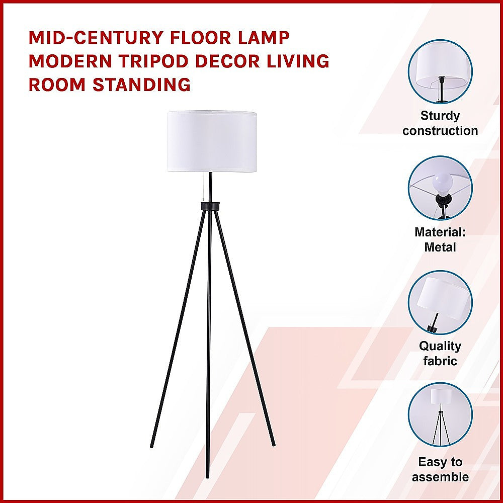 Mid century tripod floor lamp with ivory drum shade and black legs