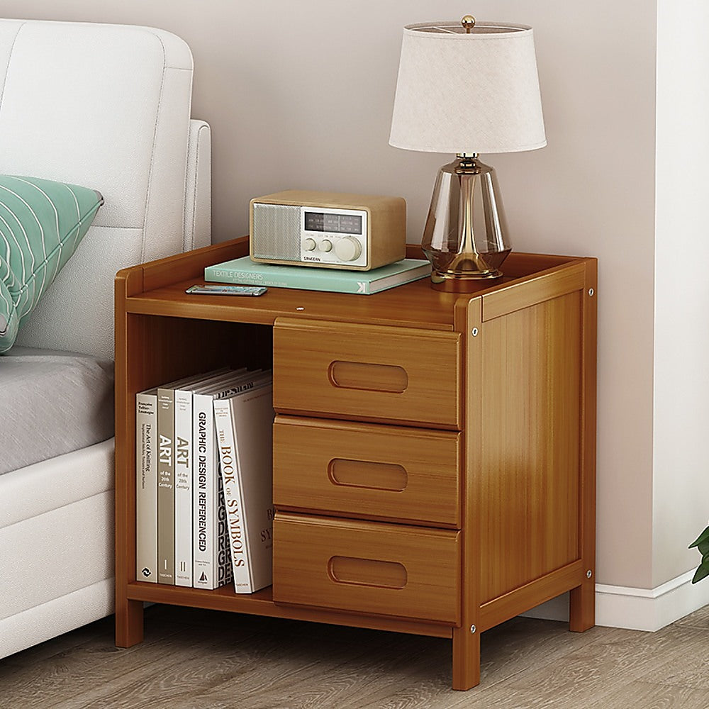 Mullumbimby dark wood bamboo three drawer bedside table with open shelf in a bright bedroom